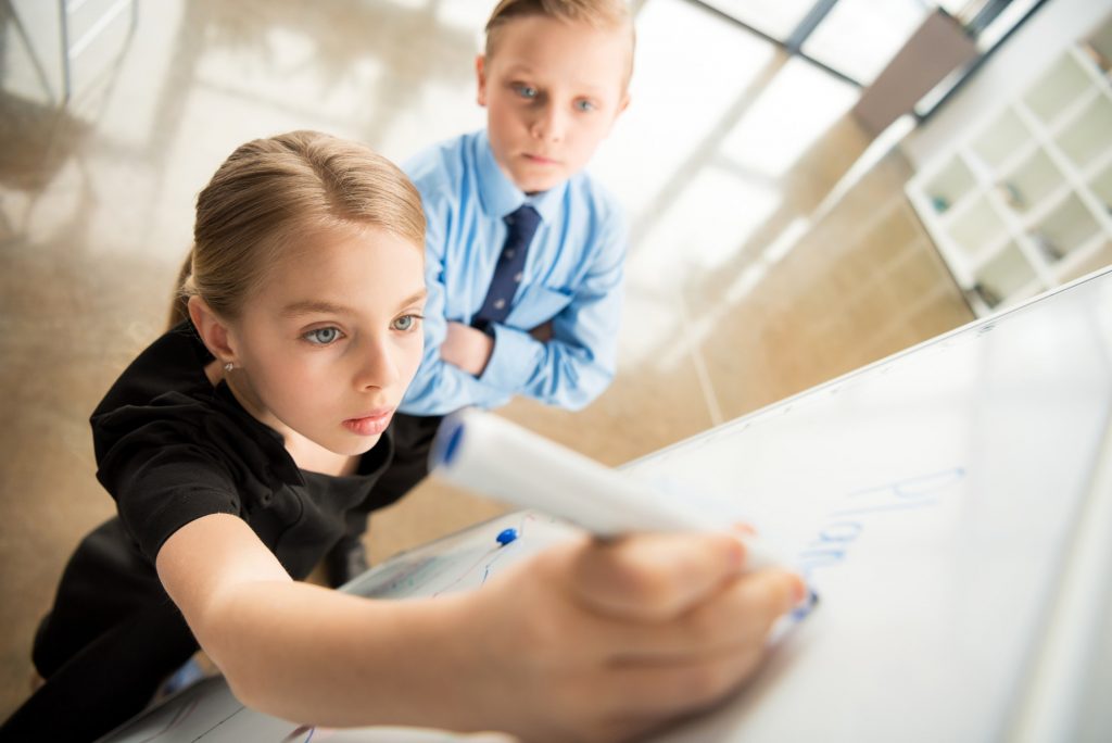 Children in formal clothes making presentation, children in business concept