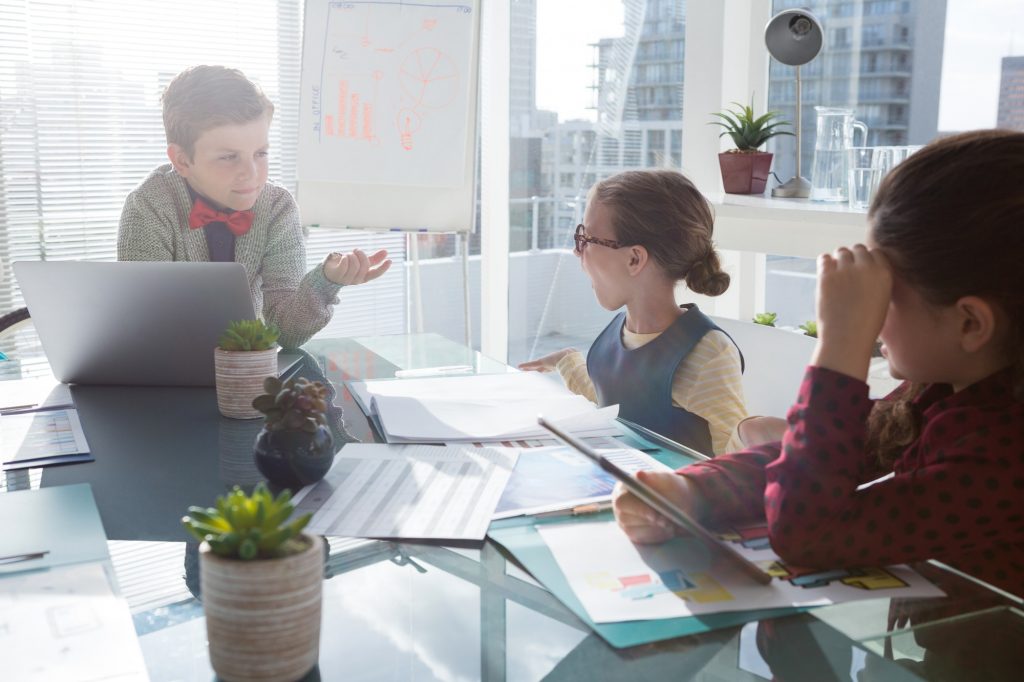 Children playing as business people